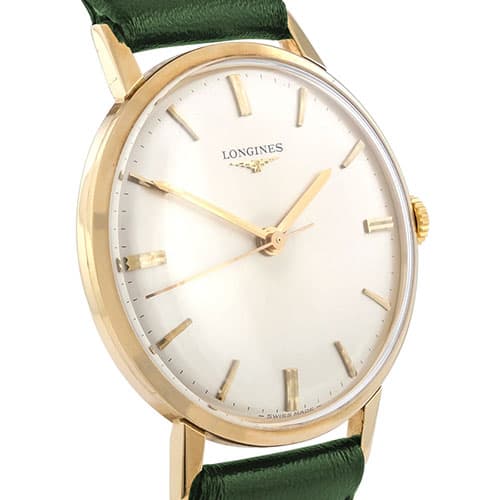 A vintage Longines dress watch with a green leather strap